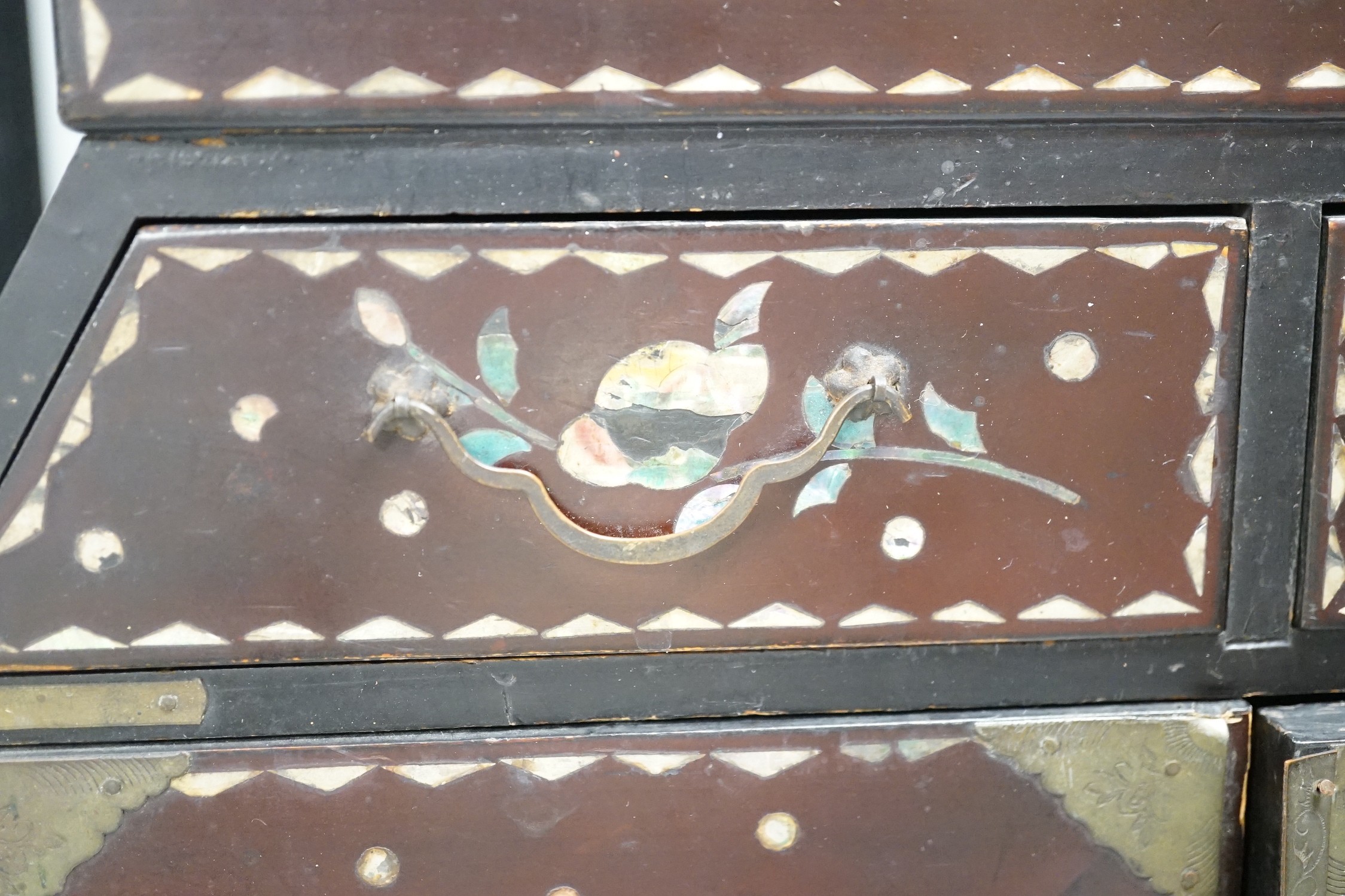 A Japanese inlaid mother-of-pearl miniature chest. 36cm tall